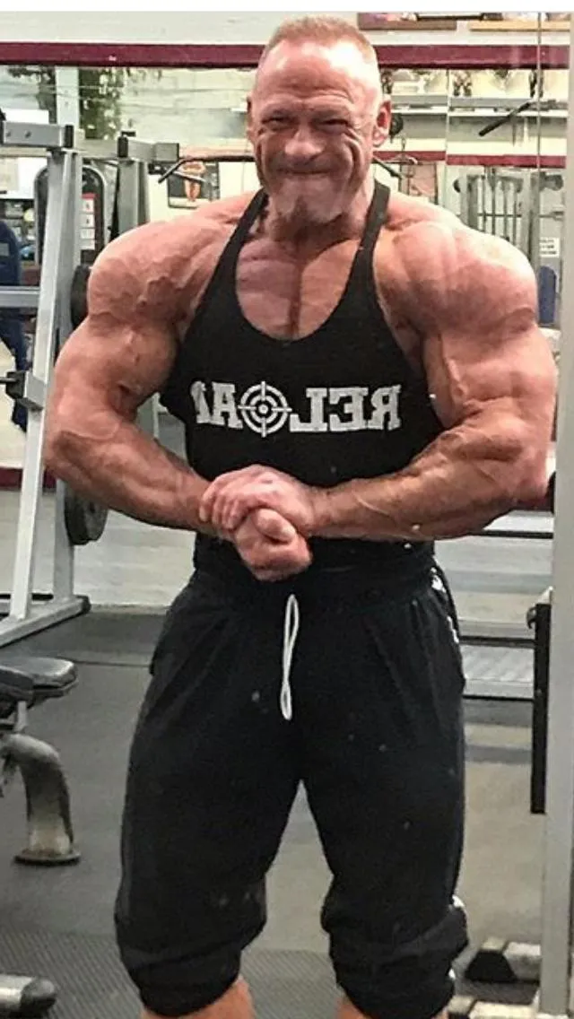 Garth Betteley flexing in the gym